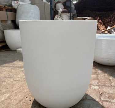 Long Lifetime Warranty Fiber Pot – Available in White, Yellow, Beige & Grey, UAE. Close-up of a white chair with a blurred background