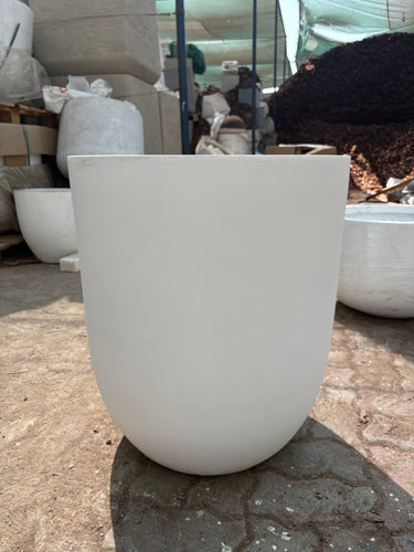 Long Lifetime Warranty Fiber Pot – Available in White, Yellow, Beige & Grey, UAE. Close-up of a white chair with a blurred background